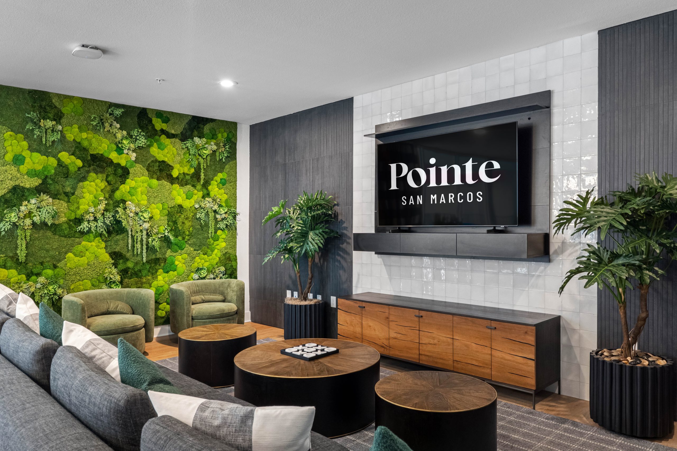 Apartment lounge with large TV and modern furniture