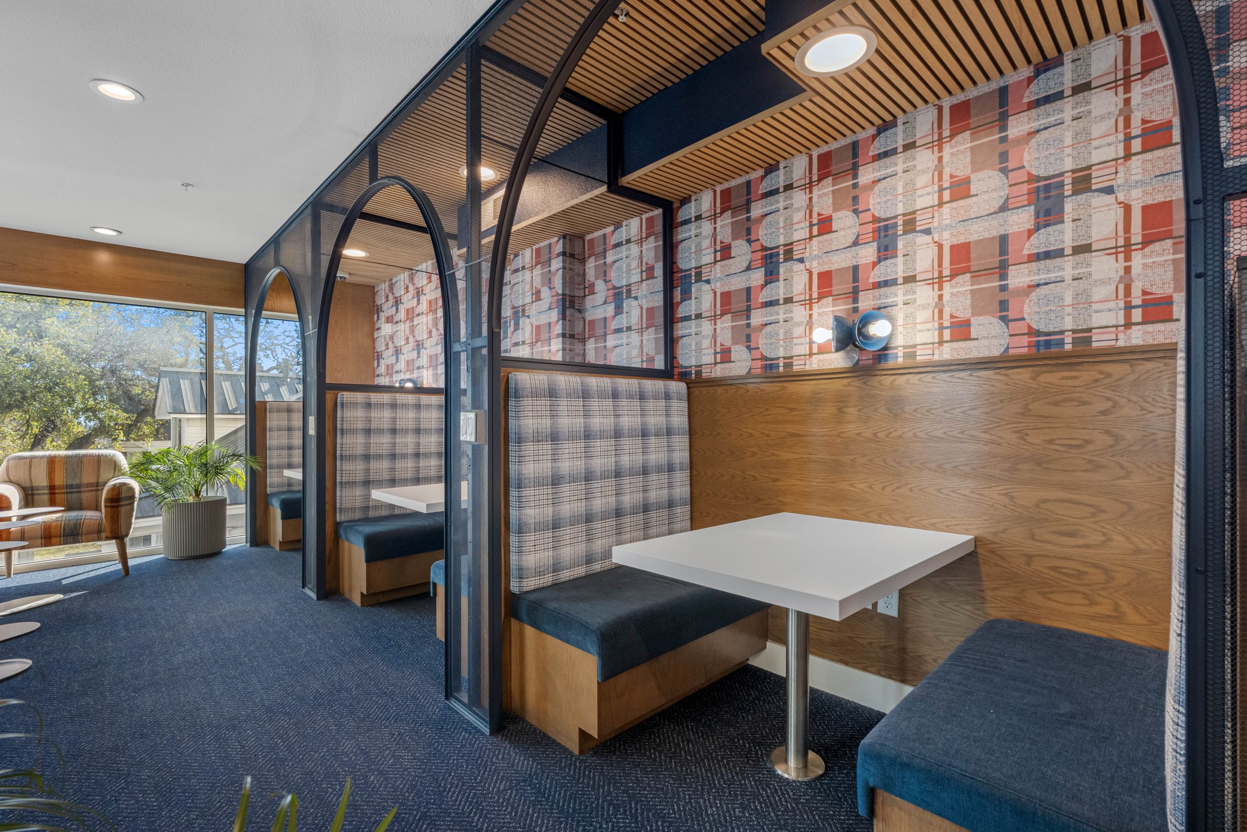 line of booths with outdoor window view.